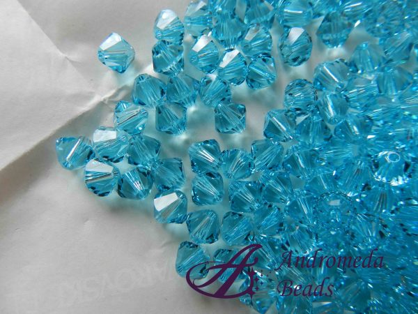 5 Cristalli Swarovski bicono 5328 6mm Light Turquoise
