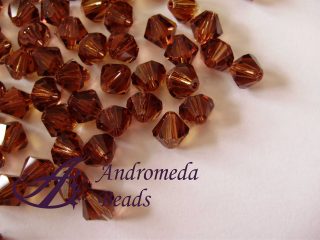5 Cristalli Swarovski bicono 5328 6mm Smoked Topaz