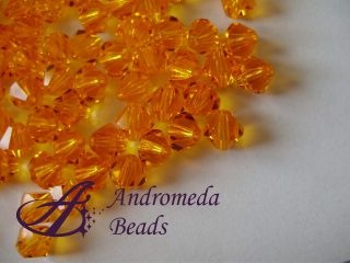 10 Cristalli Swarovski bicono 5328 4mm Sun