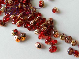 SuperDuo 5x2.5mm colore 90080/27101 Ruby Capri Gold 10g